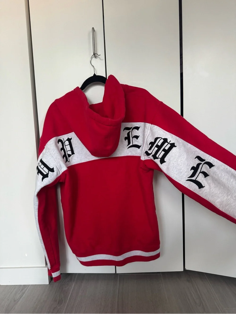 Supreme Red and White Zip-Up Hoodie with Gothic Script